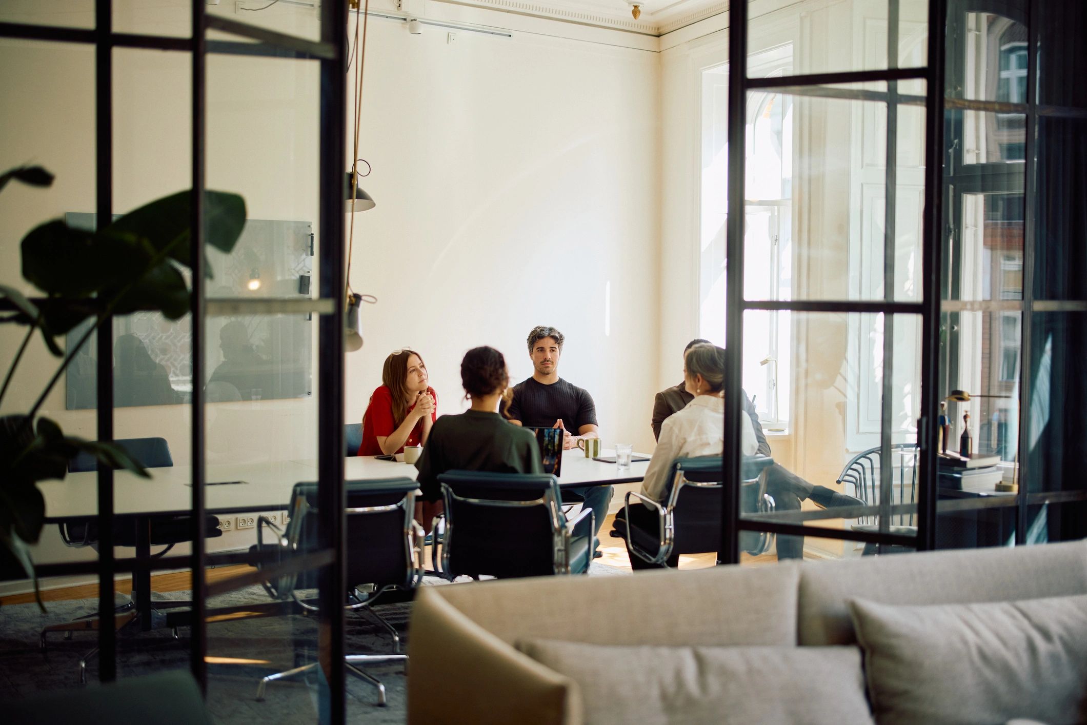 Business professionals collaborating in a modern office meeting