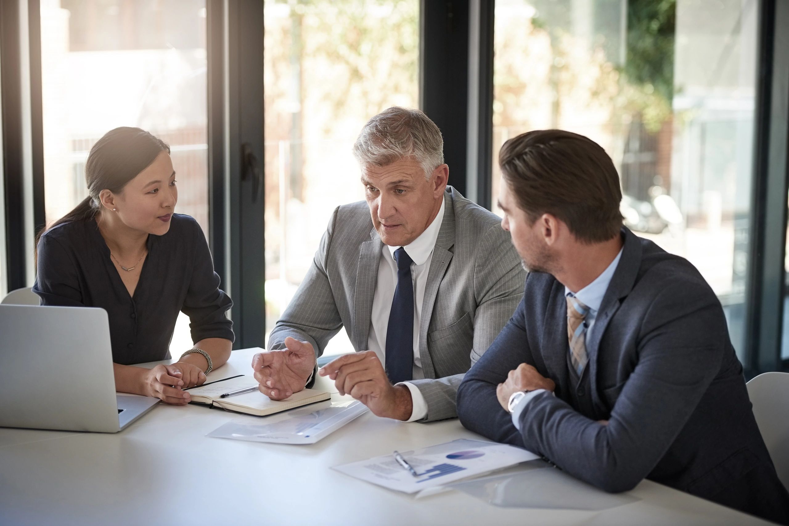 Business advisor leading a team meeting in a boardroom
